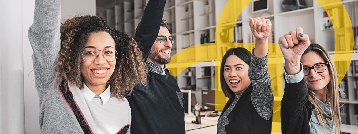 Featured image for article titled "Power Skills: Key to Boosting Business Growth Power Skills: Key to Boosting Business Growth" showing a group of 4 people with their fists up in the air, smiling, as if they just achieved something great.
