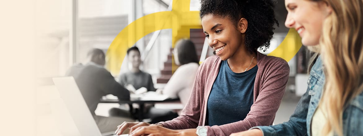 Featured image for article titled "A Look at the Future Challenges of Diversity in the Workplace" showing two women of different ethnic backgrounds working together with Elev8's logo behind in yellow.