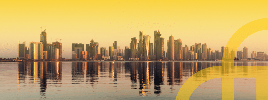Featured image for article titled "Qatar Chooses Elev8 to Provide Digital Skilling and Cyber Resiliency Training to its Citizens" showing the skyline of Doha with Elev8's logo in the right corner in yellow.