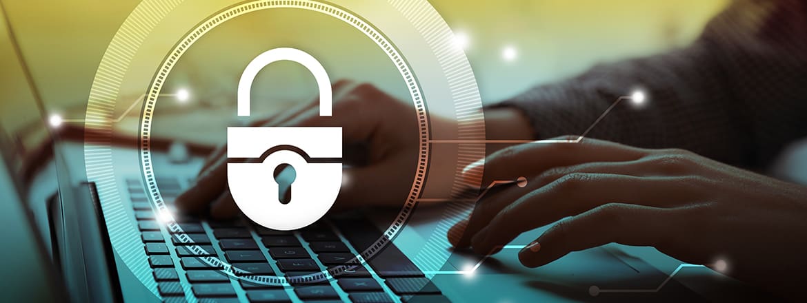 Featured image for article titled "Cybersecurity: Required Skills to Protect Your Business" showing a padlock icon in a circle on the background of a person's hands typing on a laptop.